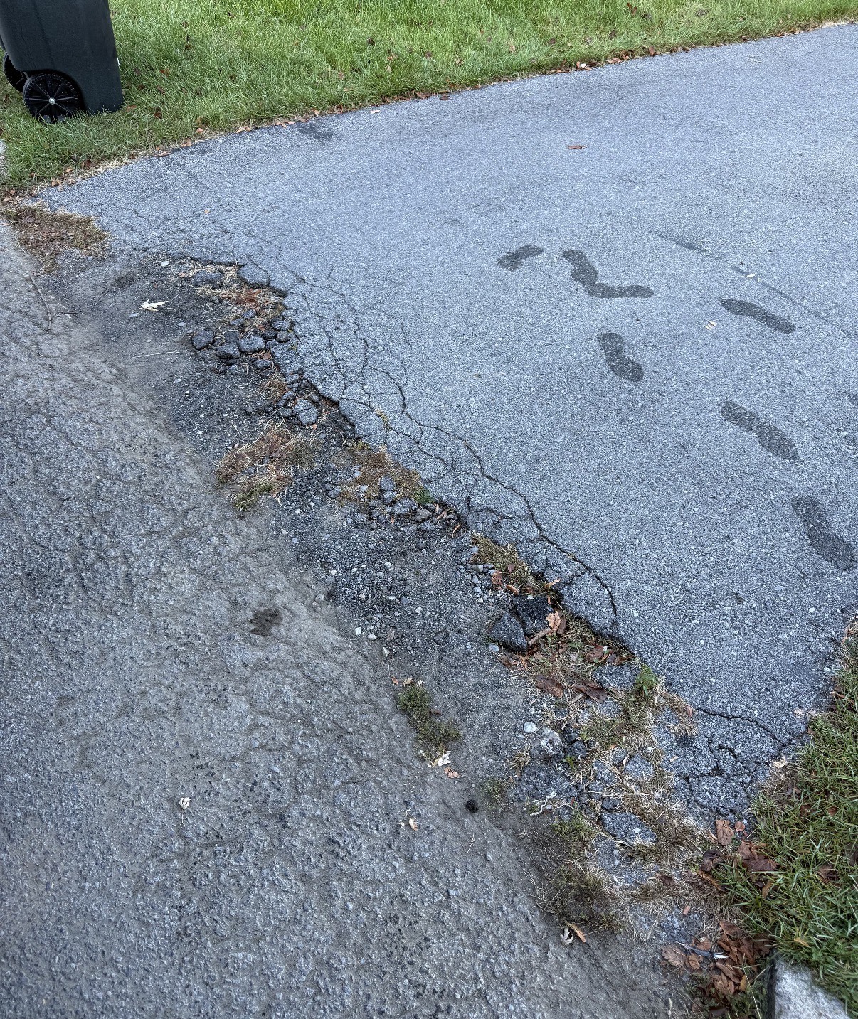 Damaged asphalt before patch repair