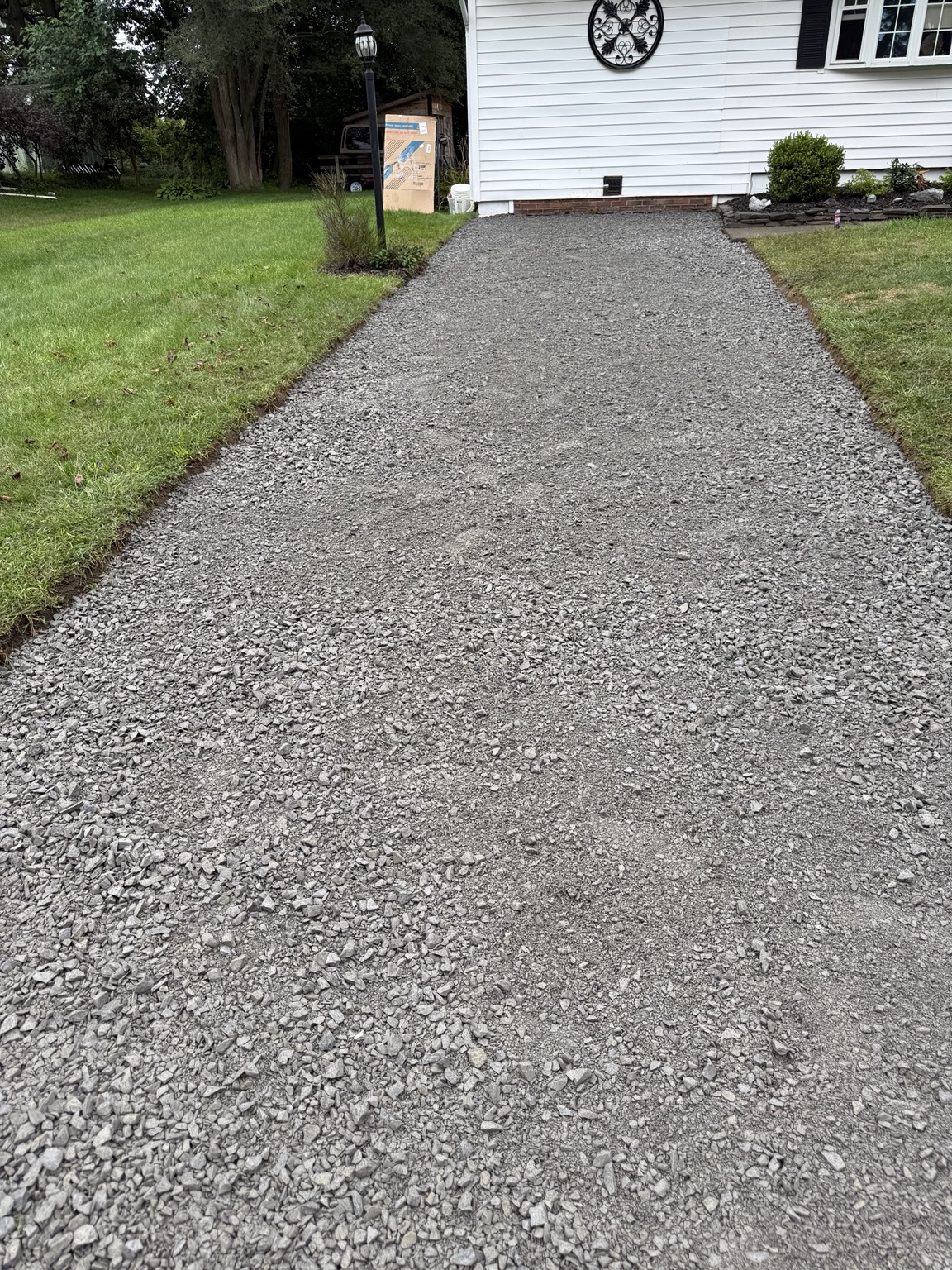 Worn driveway before paving
